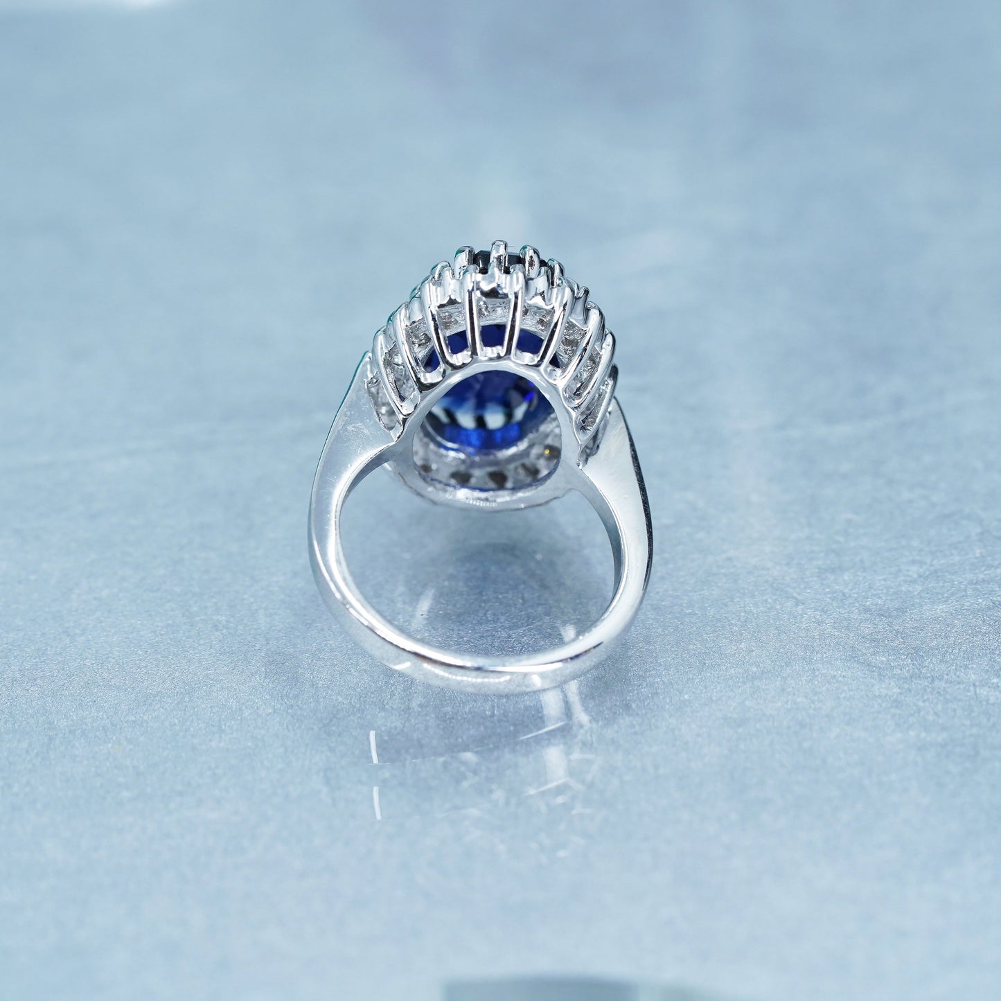 Size 8.25, vintage silver tone statement ring with blue glass and cz around