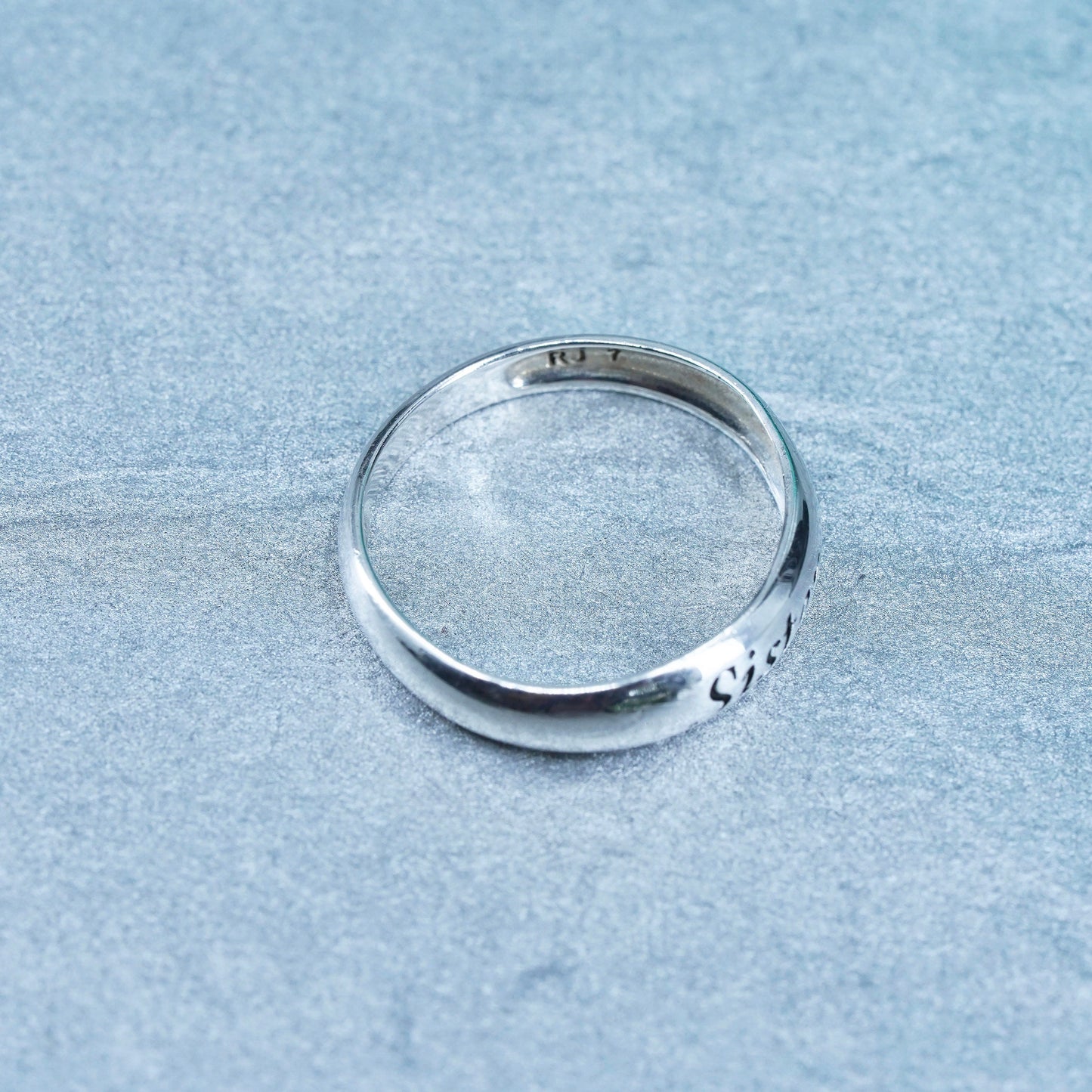 Size 7, vintage southwestern Sterling 925 silver ring, band embossed “sister”