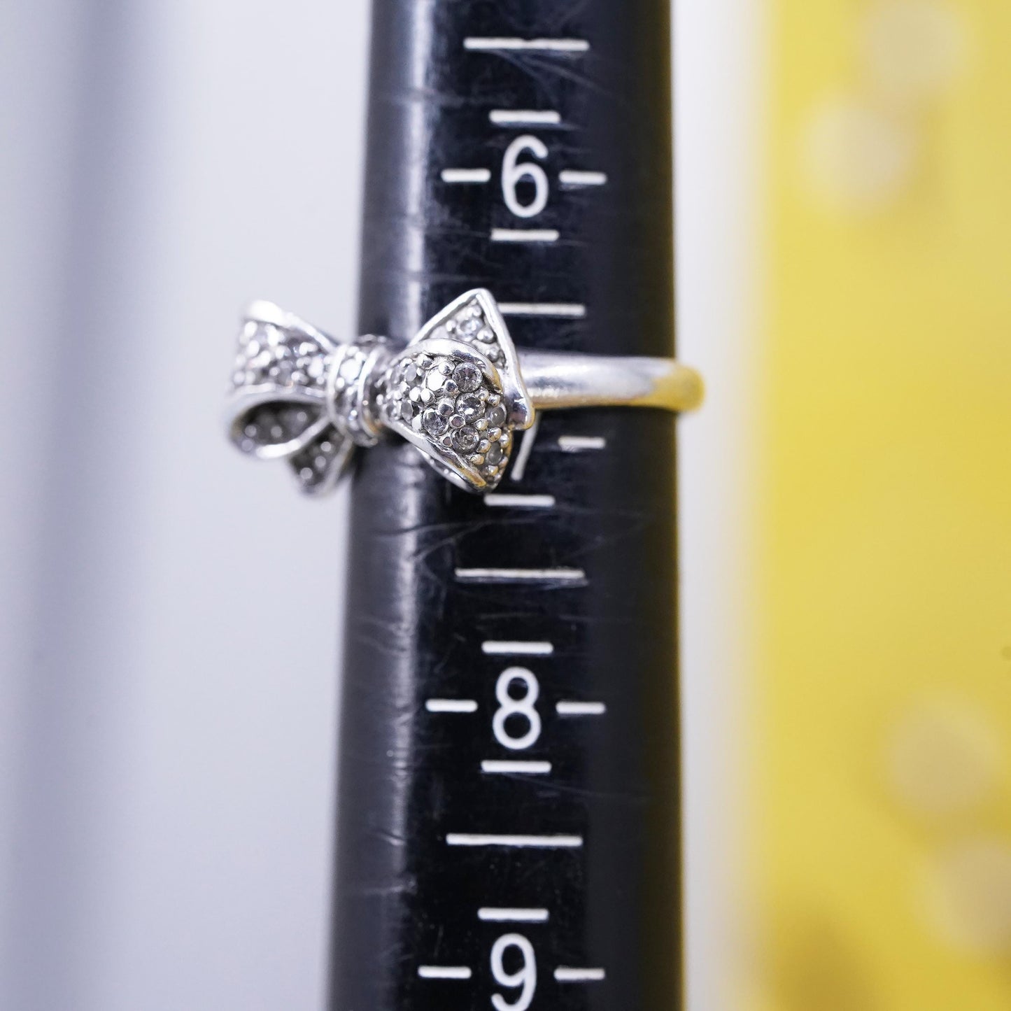 Size 6.75, vintage Sterling 925 silver ribbon bow tie ring with cluster cz