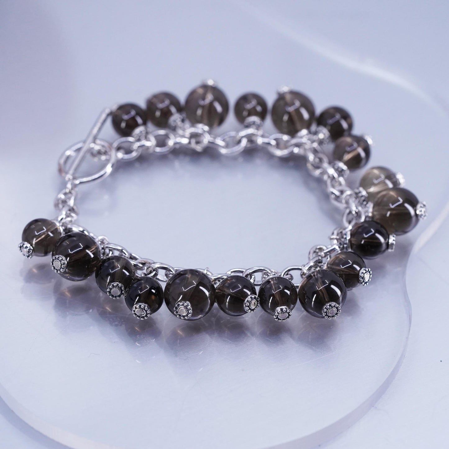 6.75”, Sterling 925 silver bracelet with smoky crystal beads and toggle closure