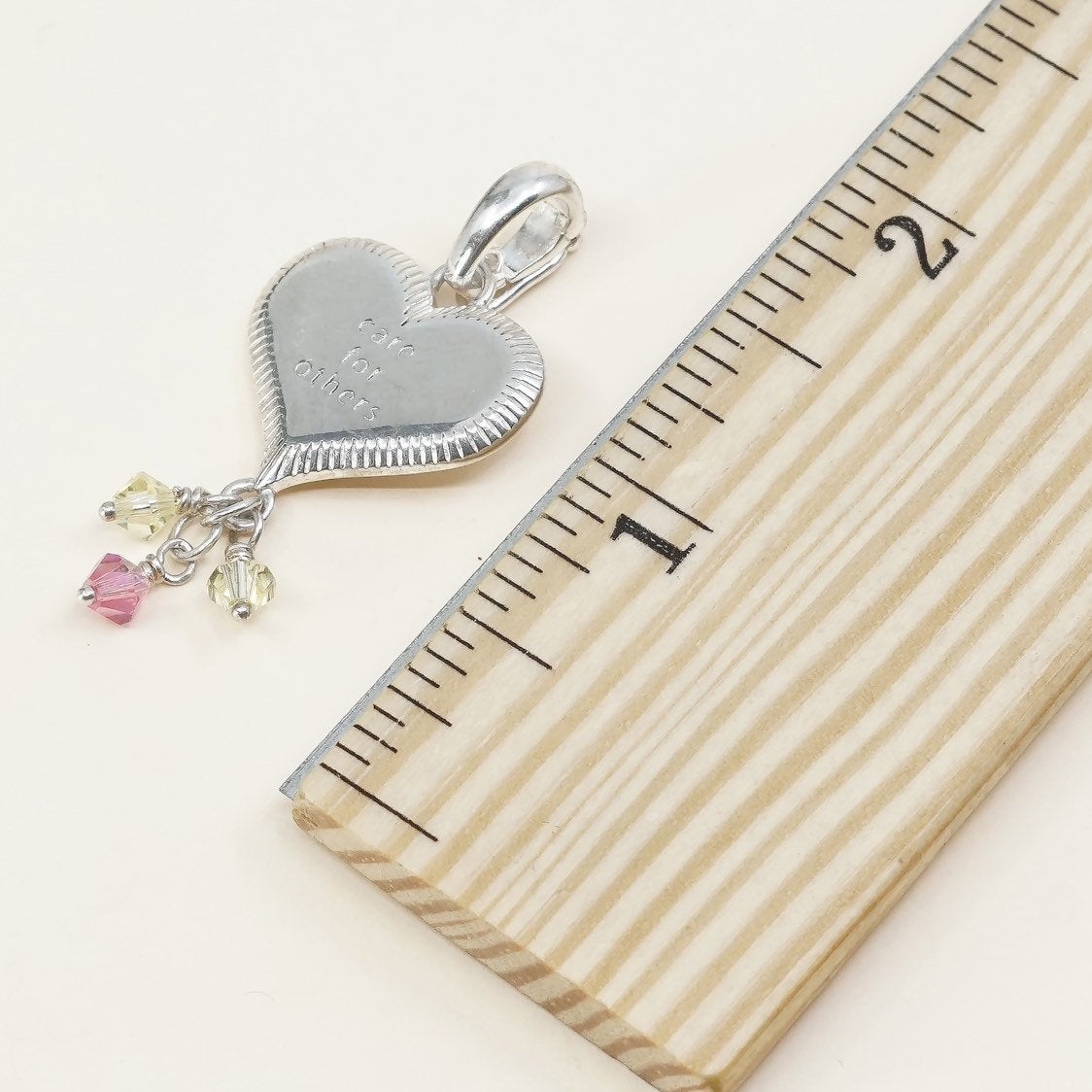 handmade sterling silver heart charm embossed “care for others”, 925 pendant