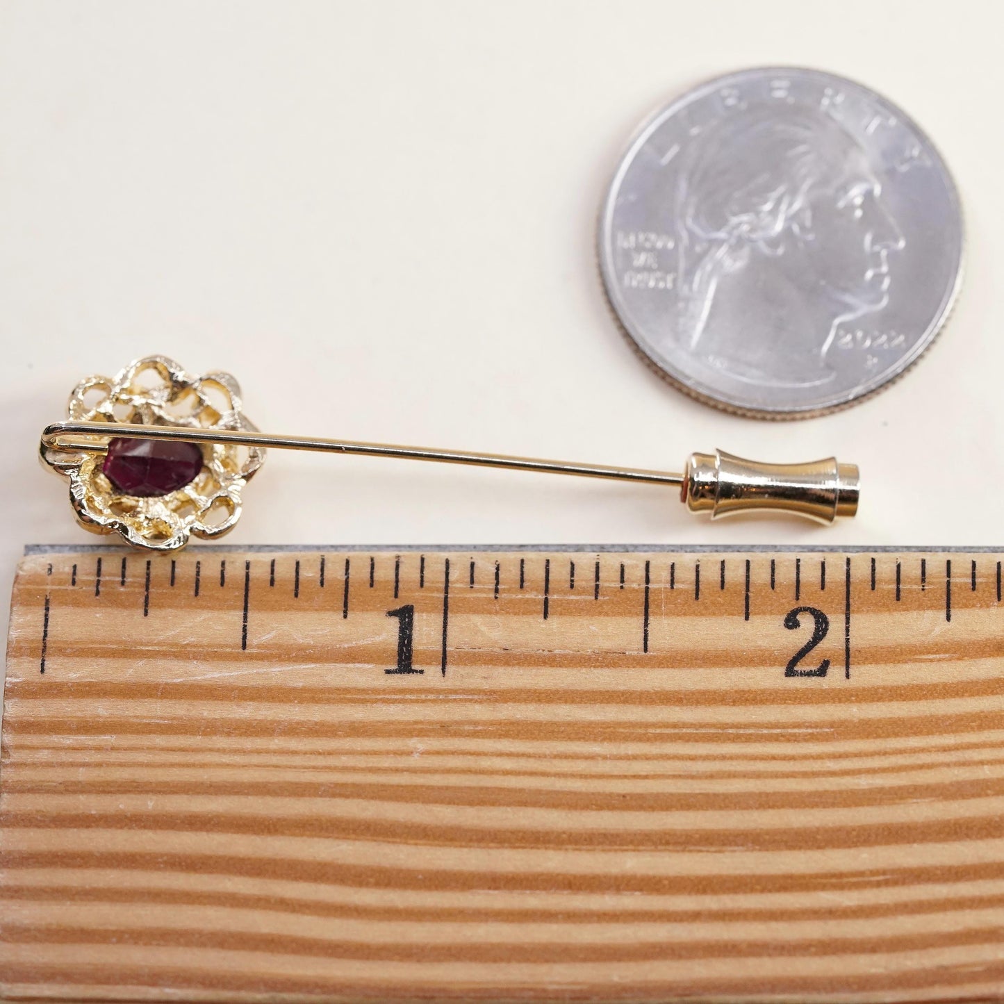 Vintage gold tone pin with garnet