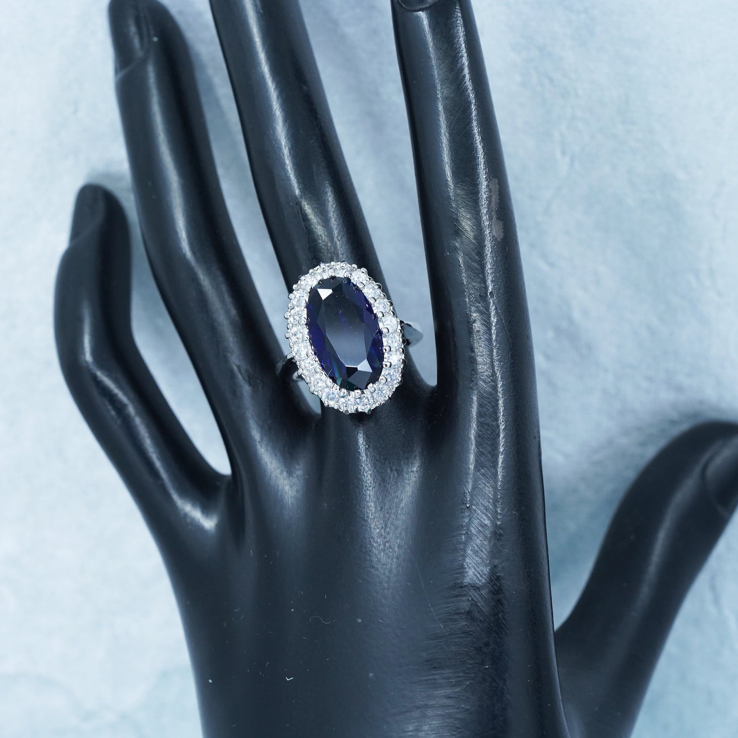 Size 8.25, vintage silver tone statement ring with blue glass and cz around