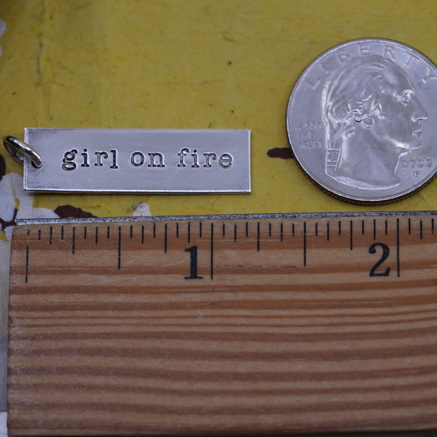 Sterling silver charm, 925 tag pendant embossed “girl on fire”