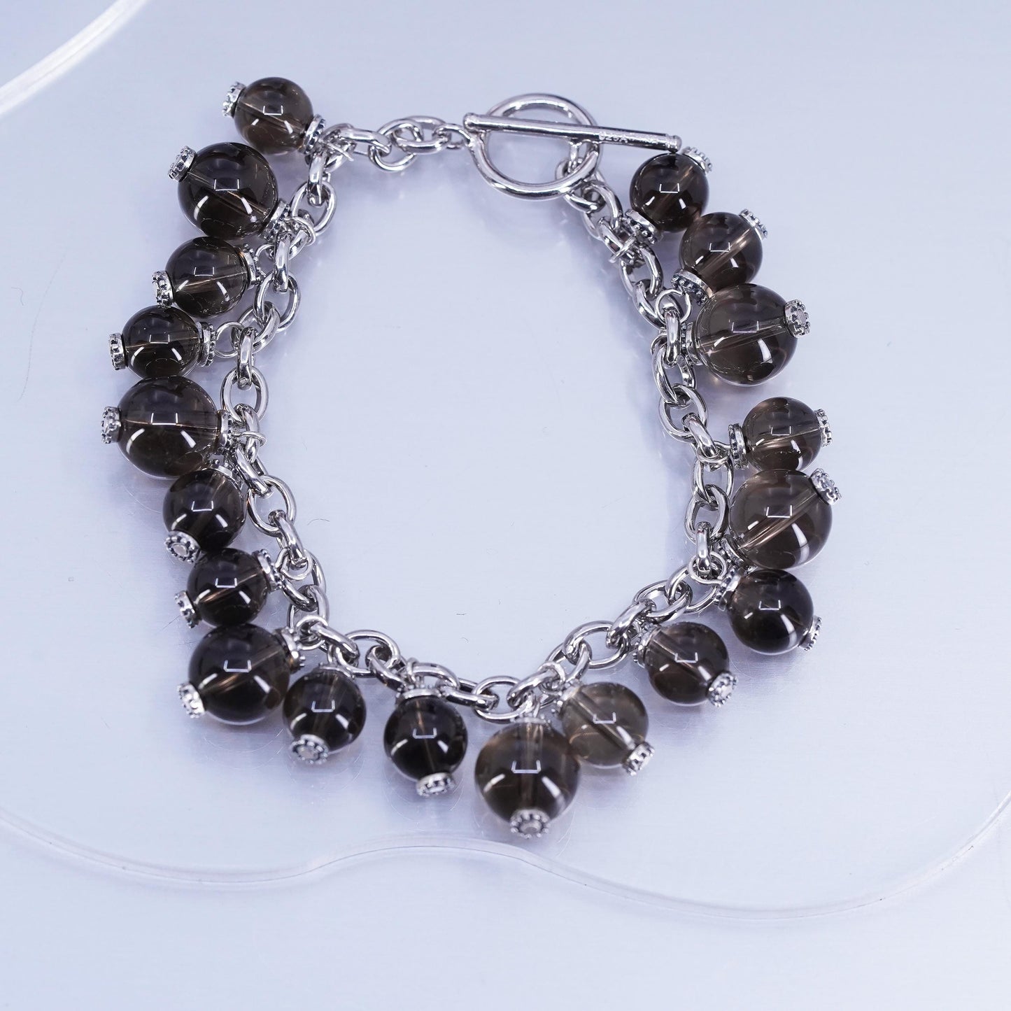 6.75”, Sterling 925 silver bracelet with smoky crystal beads and toggle closure
