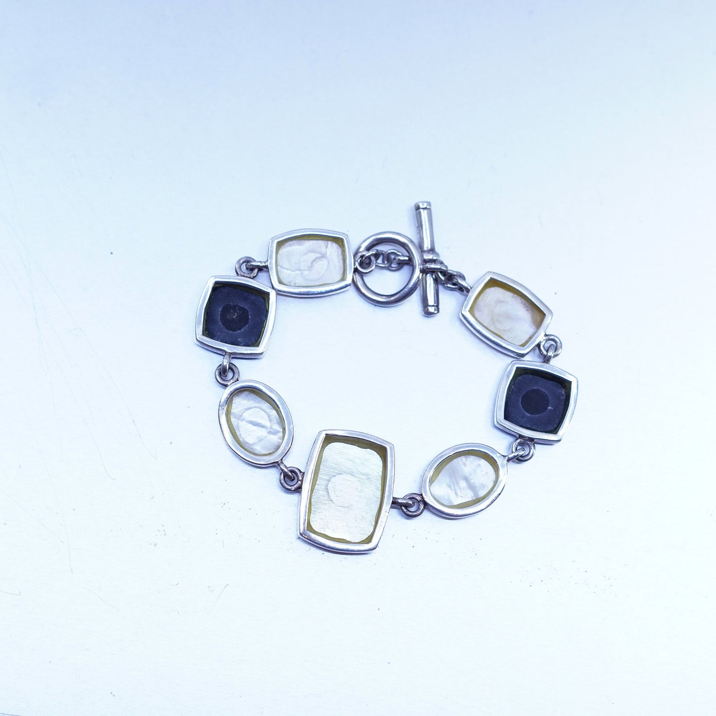 6.75”, VTG sterling 925 silver bracelet w/ black onyx golden mother of pearl