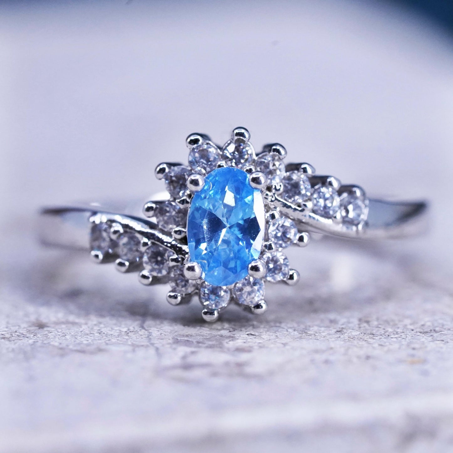 Size 7, vintage sterling 925 silver handmade ring with blue topaz and cz around