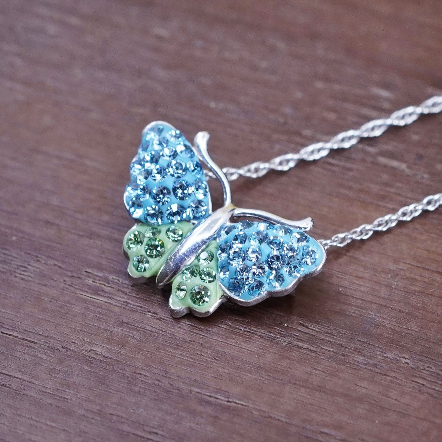 18”, Sterling silver necklace, 925 Singapore rope chain w/ butterfly pendant cz