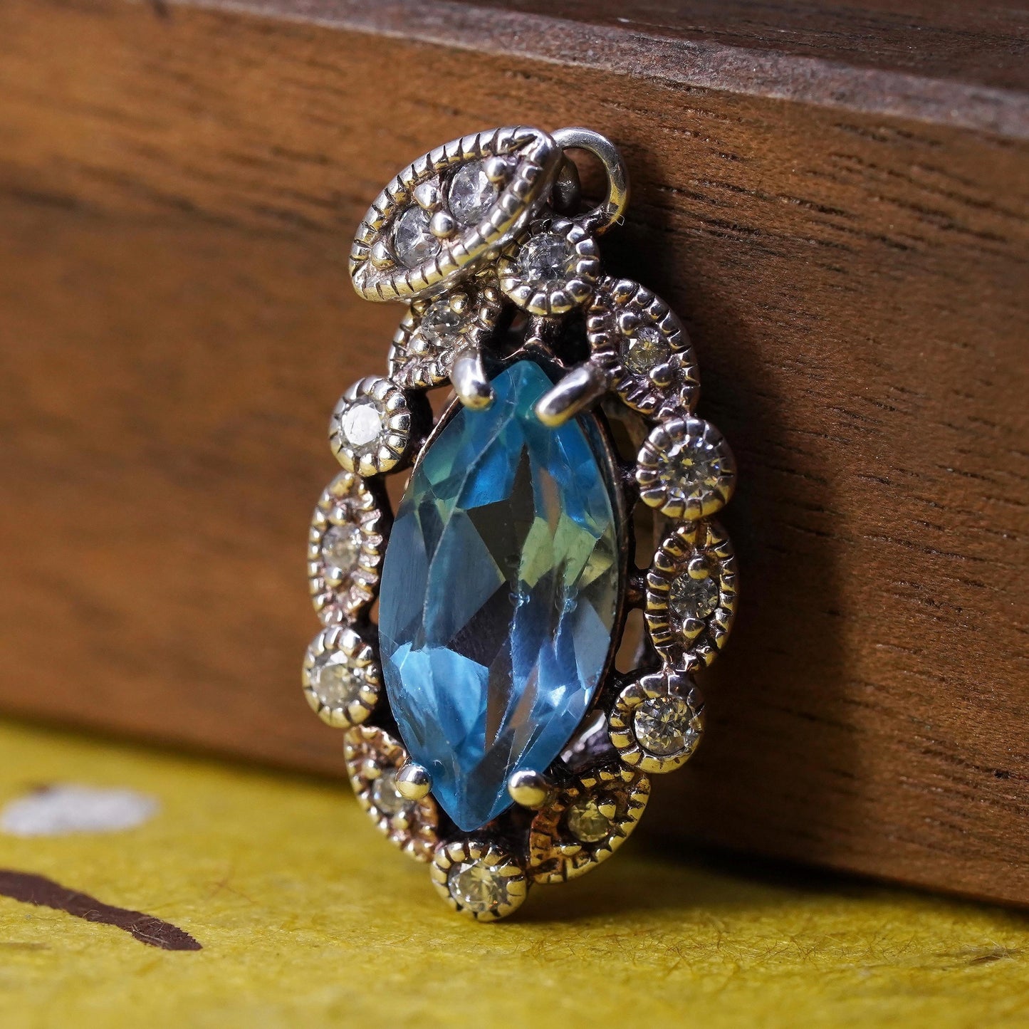 Vintage Sterling 925 silver handmade pendant with blue topaz and cz around