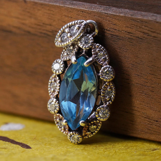 Vintage Sterling 925 silver handmade pendant with blue topaz and cz around