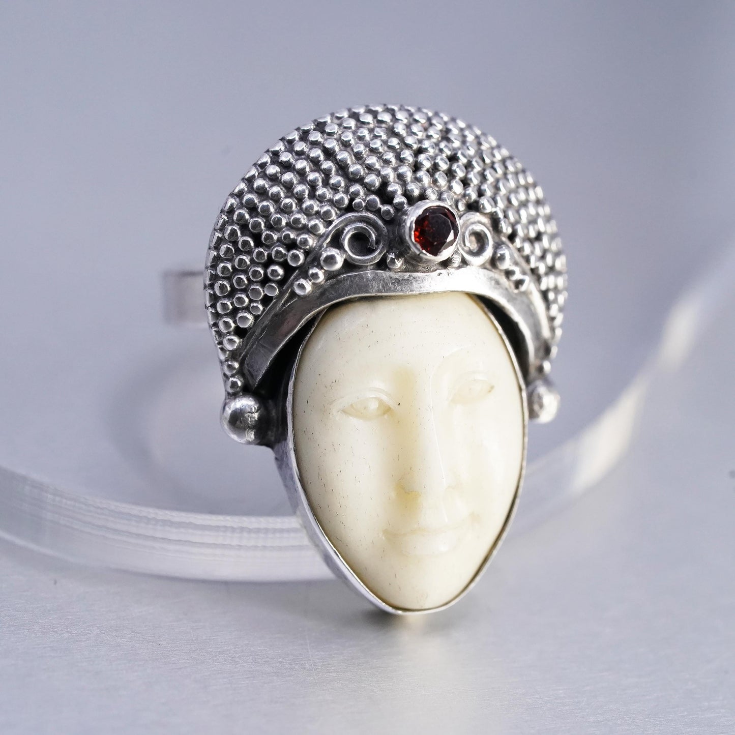 Size 7.5, vintage Sterling 925 silver ring with carved goddess face and garnet