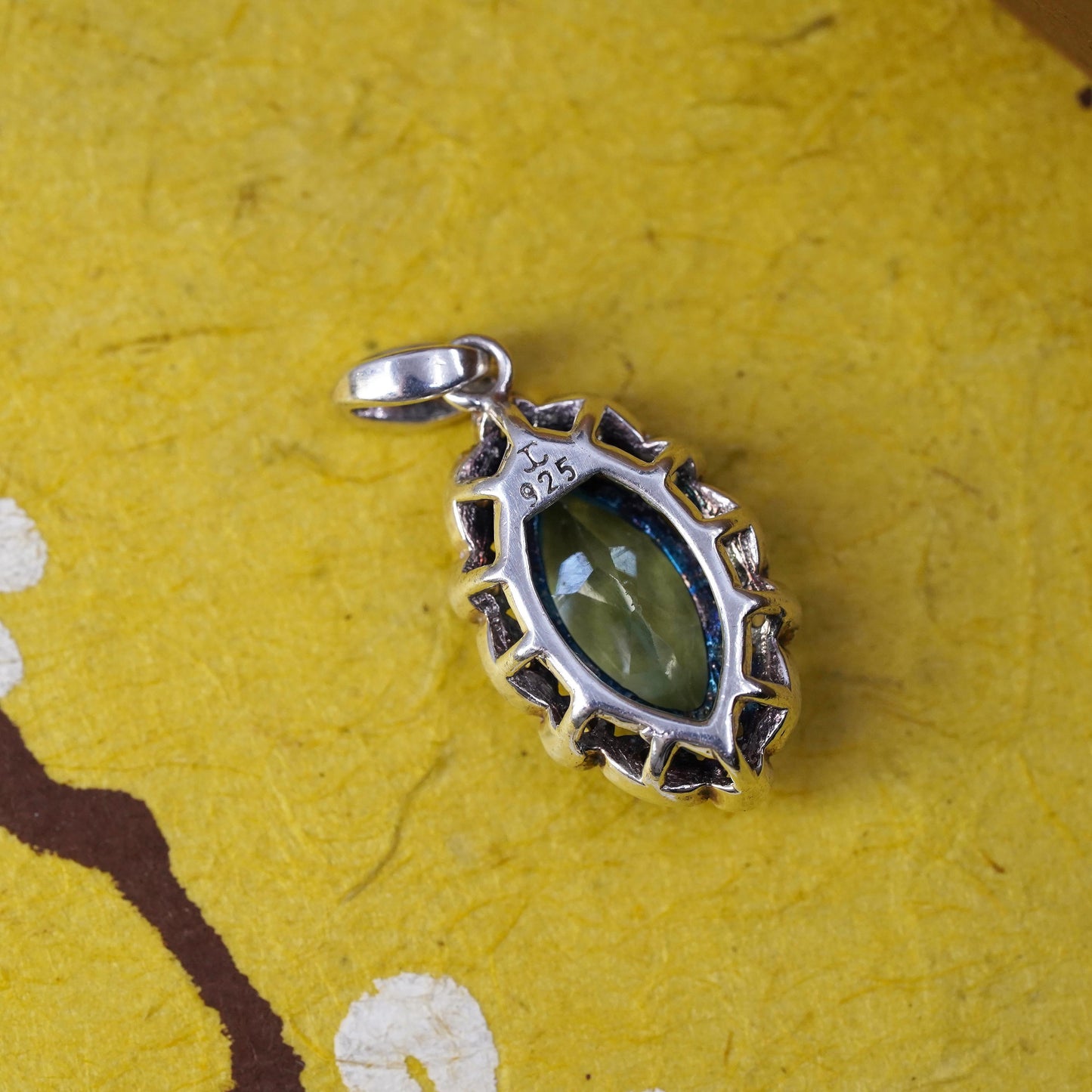 Vintage Sterling 925 silver handmade pendant with blue topaz and cz around