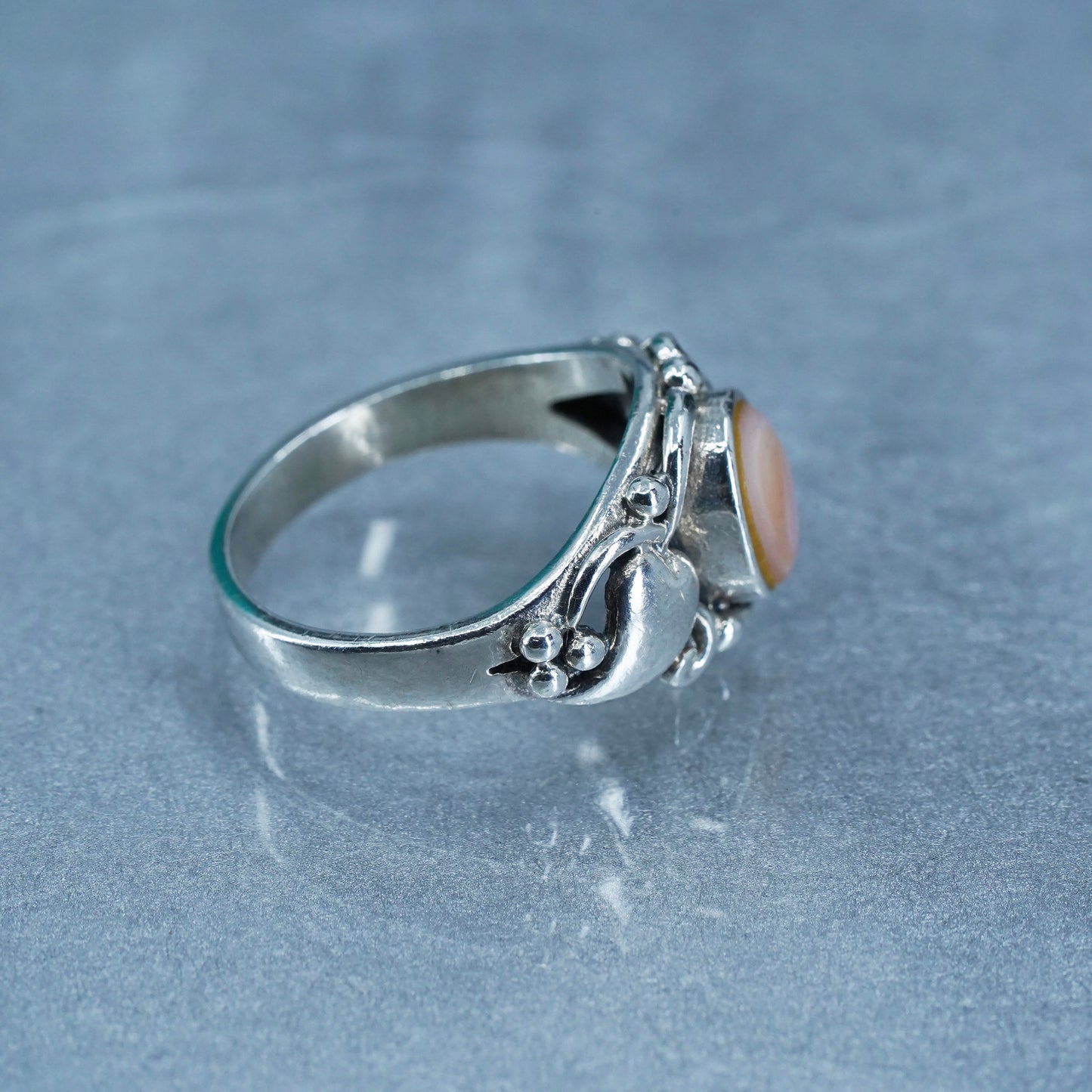 Size 8.25, Sterling 925 silver ring with pink mother of pearl and hearts around
