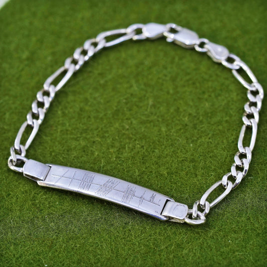 7.25” sterling silver bracelet, 925 figaro chain with line engraved bar tag