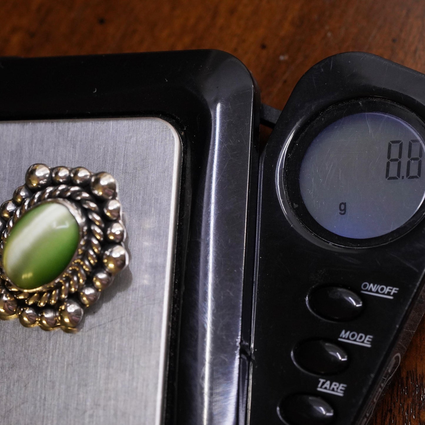 Mexican sterling silver single earring, 925 silver clip on with green cat’s eye