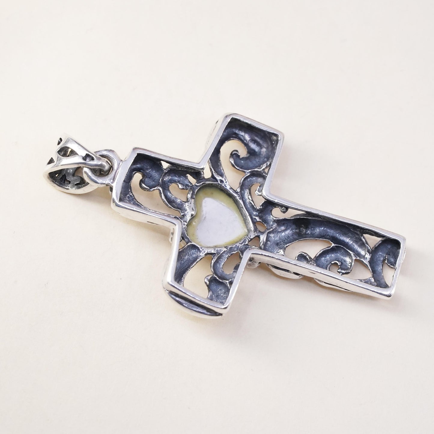 southwestern sterling silver pendant, swirly 925 cross heart mother of pearl