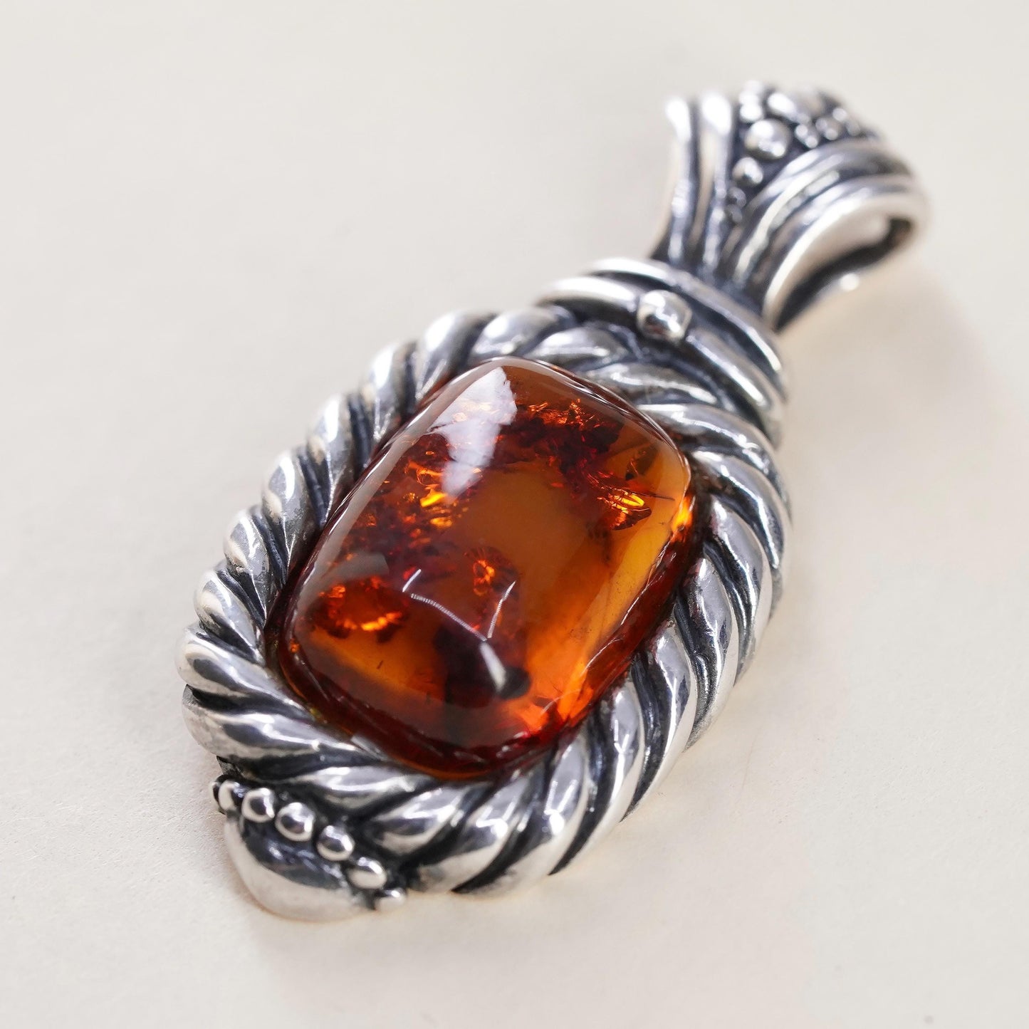 Vintage Sterling 925 silver handmade pendant with amber and cable around