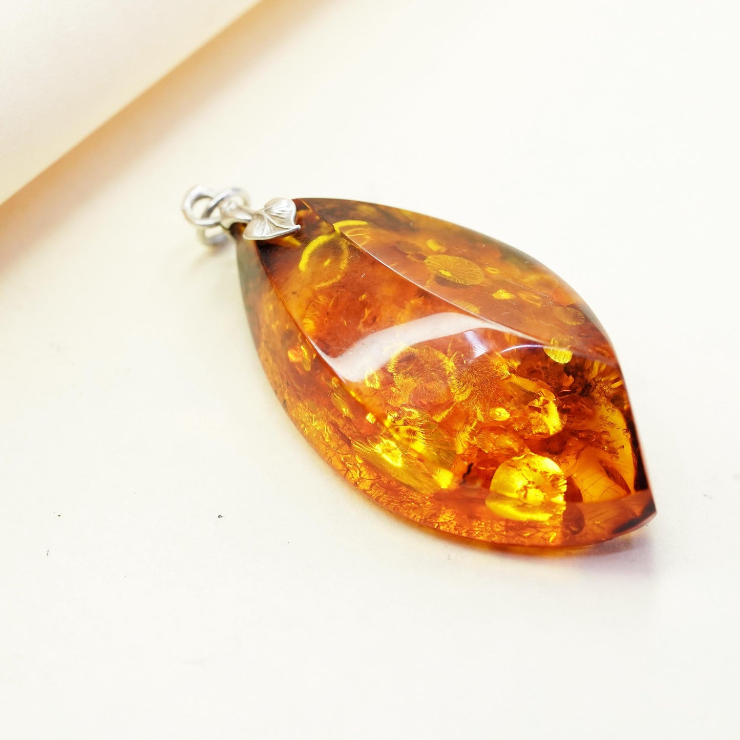 Vintage sterling 925 silver handmade pendant with amber nugget and leaf bail