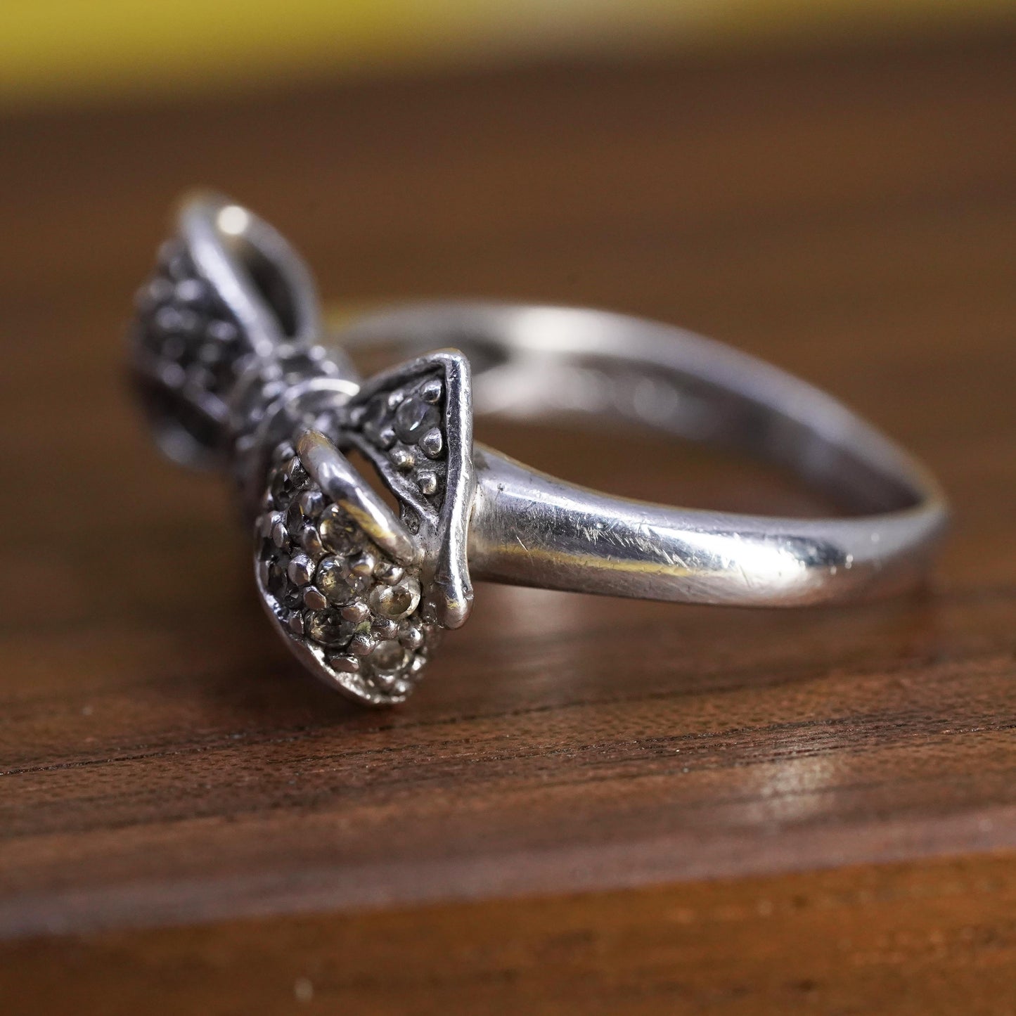 Size 6.75, vintage Sterling 925 silver ribbon bow tie ring with cluster cz