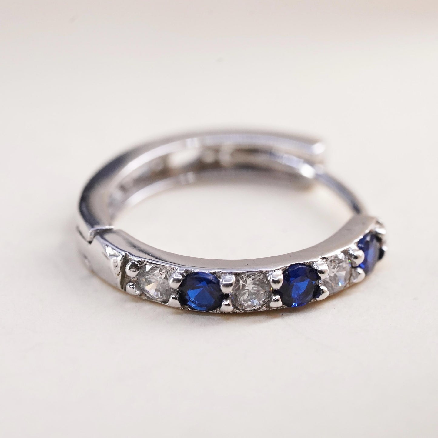0.75”, sterling silver single earring, 925 huggie hoop with sapphire and cz