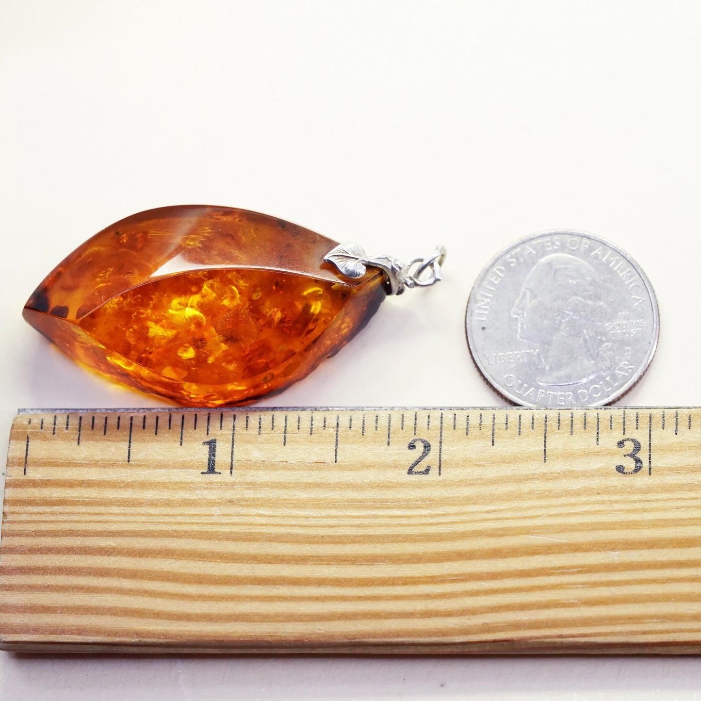 Vintage sterling 925 silver handmade pendant with amber nugget and leaf bail