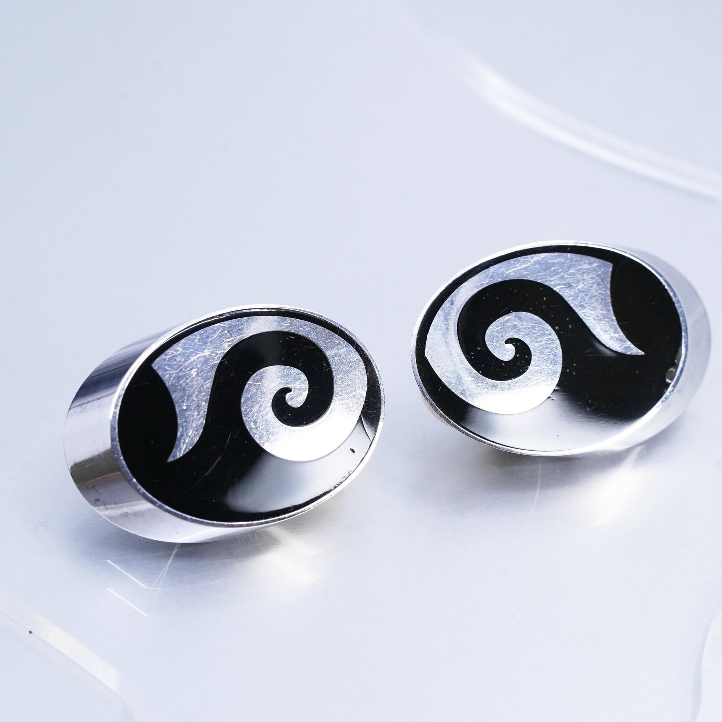 Vintage Varga Sterling Silver Oval Clip On Earrings with onyx and spiral inlay