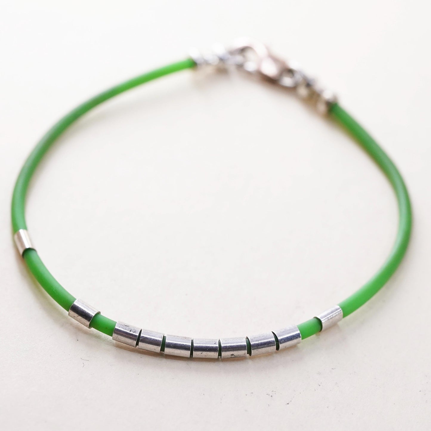 6”, Vintage green rubber band stackable bracelet with silver tone details