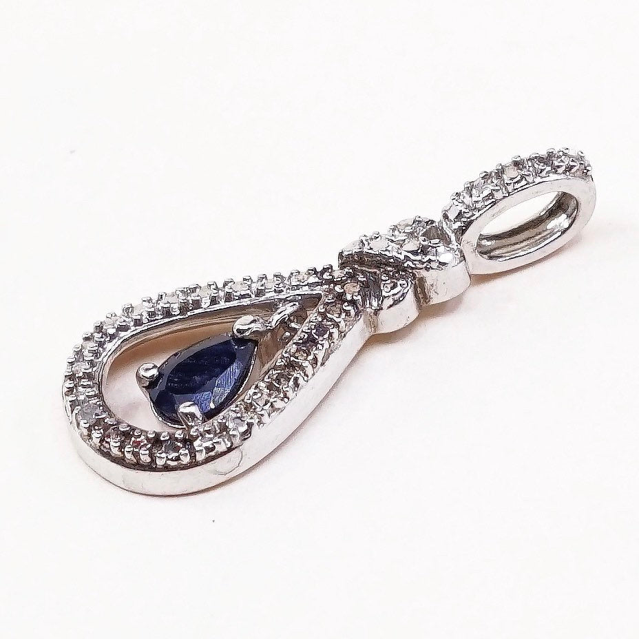 Sterling silver pendant with teardrop shaped sapphire, crystal around