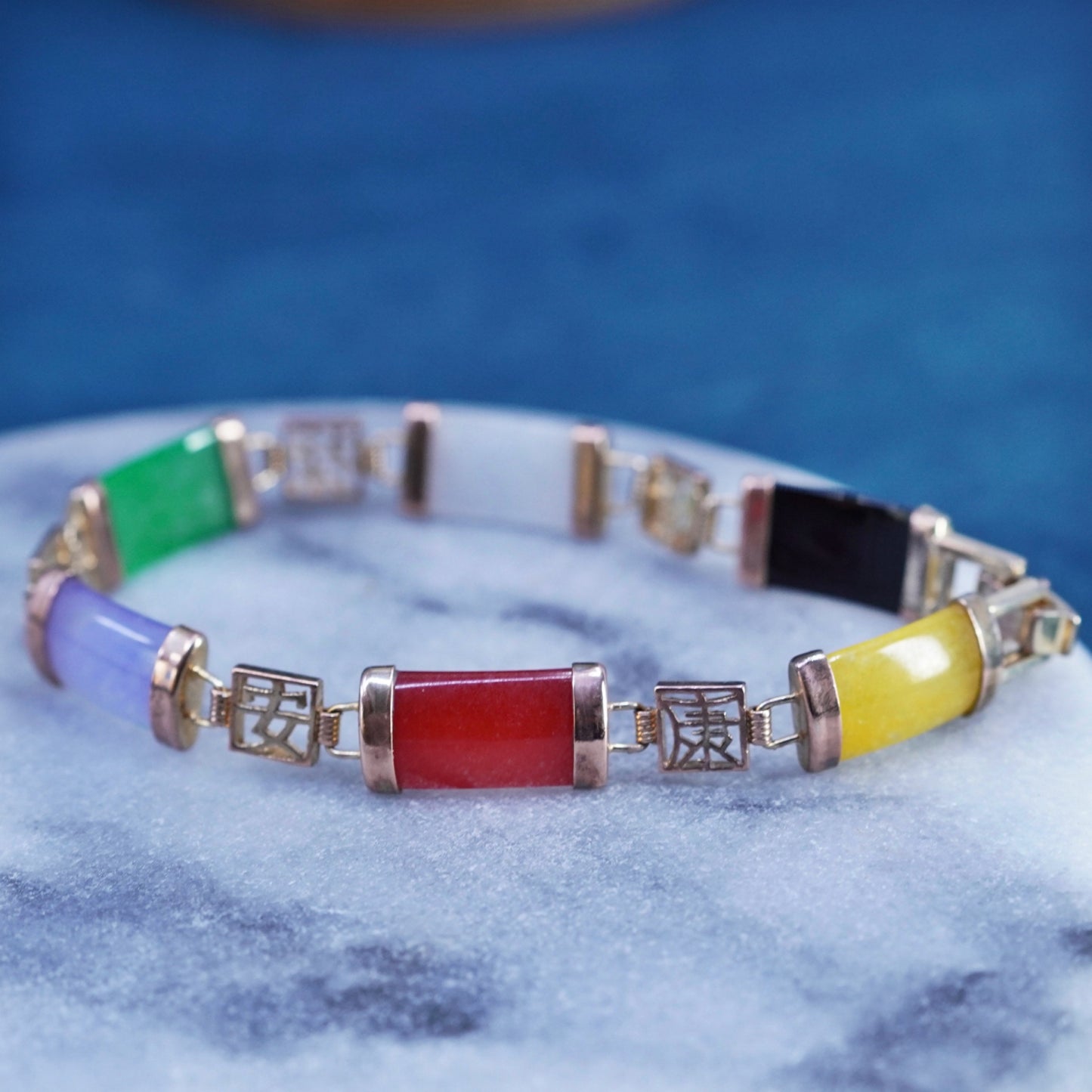 7.5”, yellow tone tennis bracelet with jade, carnelian, obsidian bar happiness