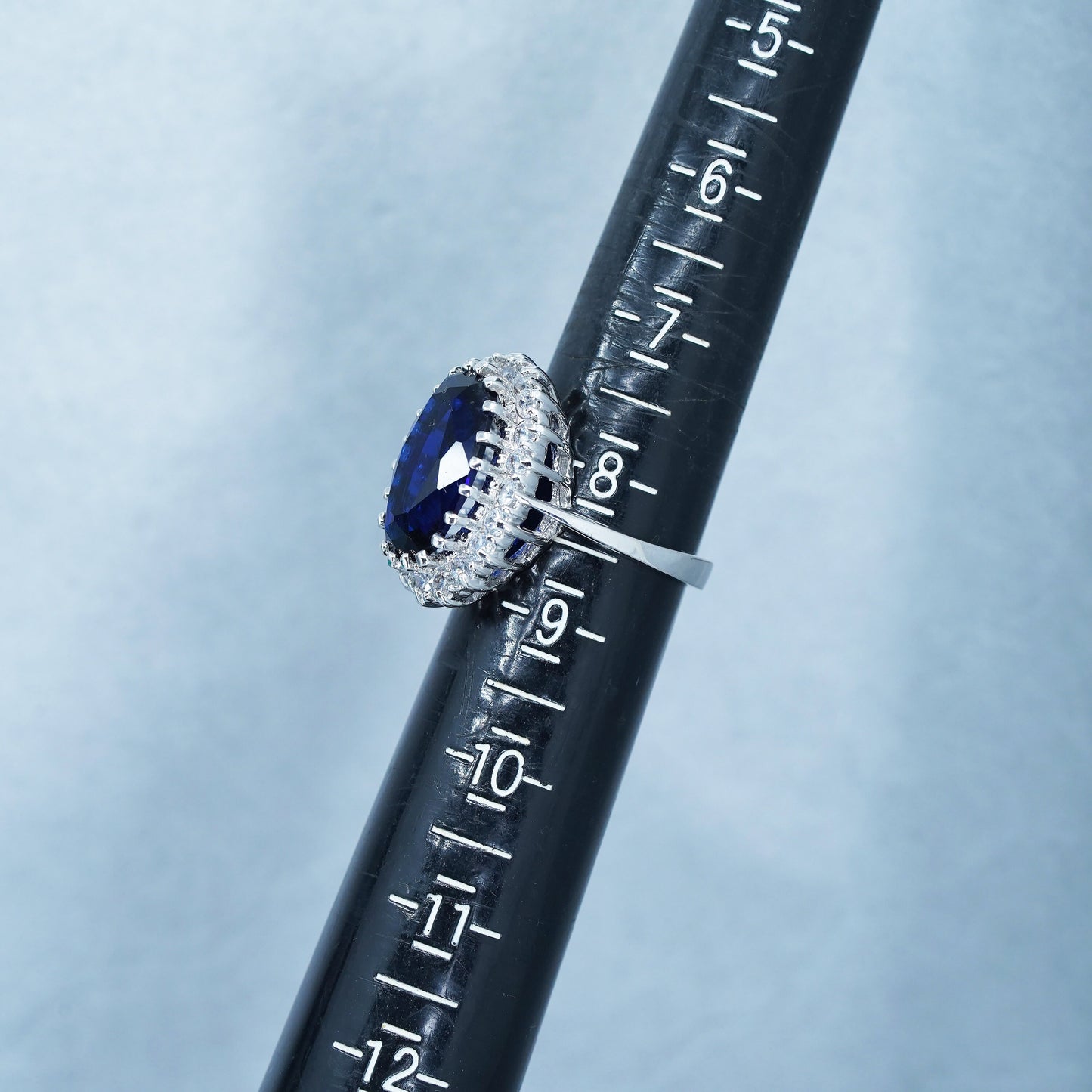 Size 8.25, vintage silver tone statement ring with blue glass and cz around