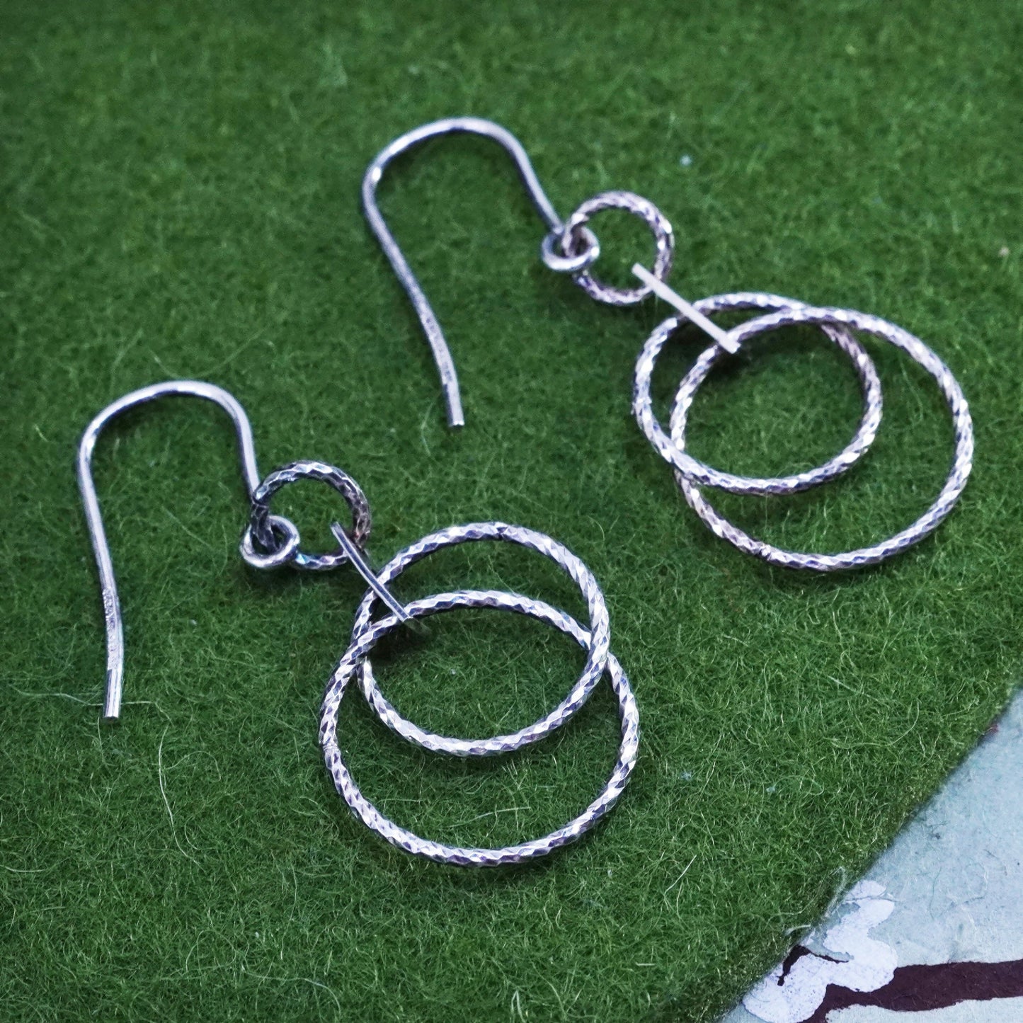 Dyadema sterling silver handmade earrings, textured 925 entwined circle dangles
