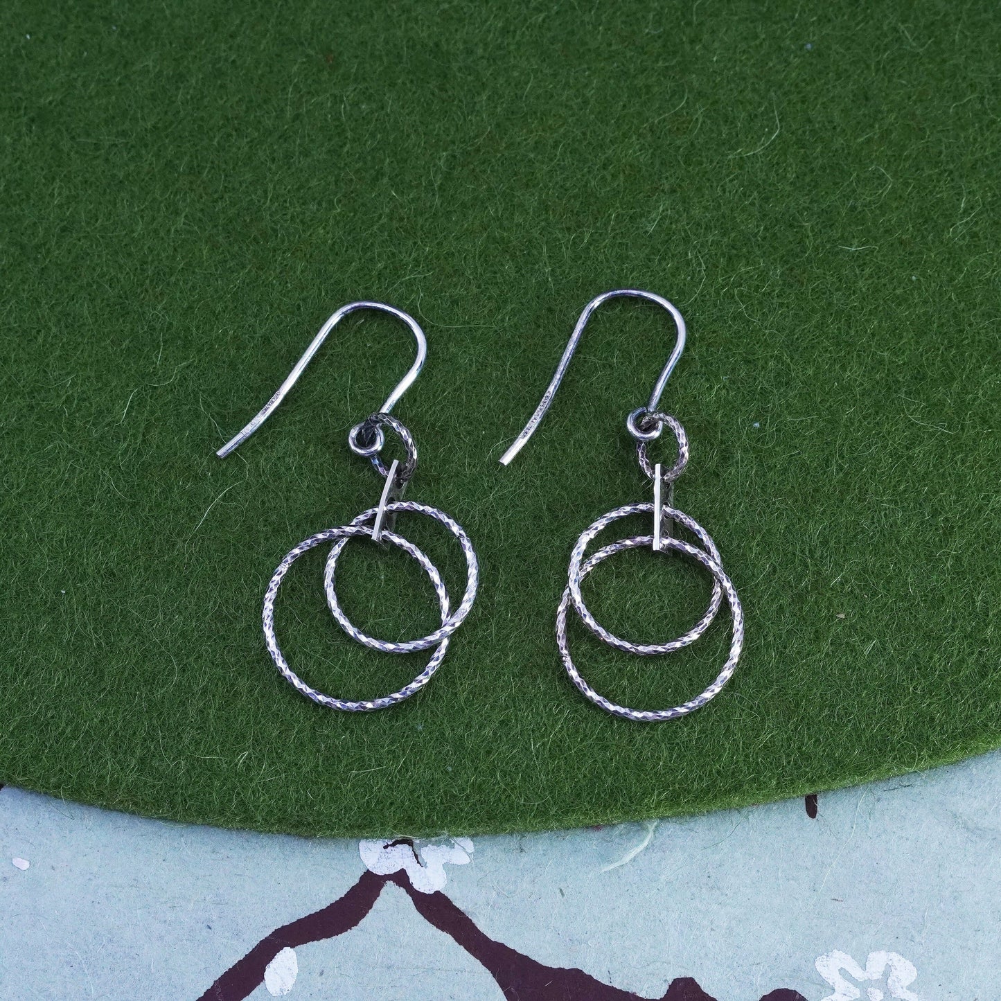 Dyadema sterling silver handmade earrings, textured 925 entwined circle dangles
