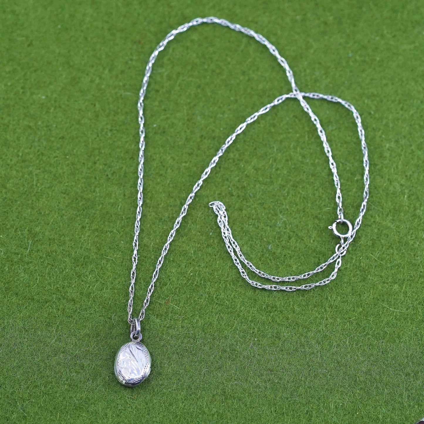 17”, sterling silver necklace, 925 Singapore rope chain oval lock pendant