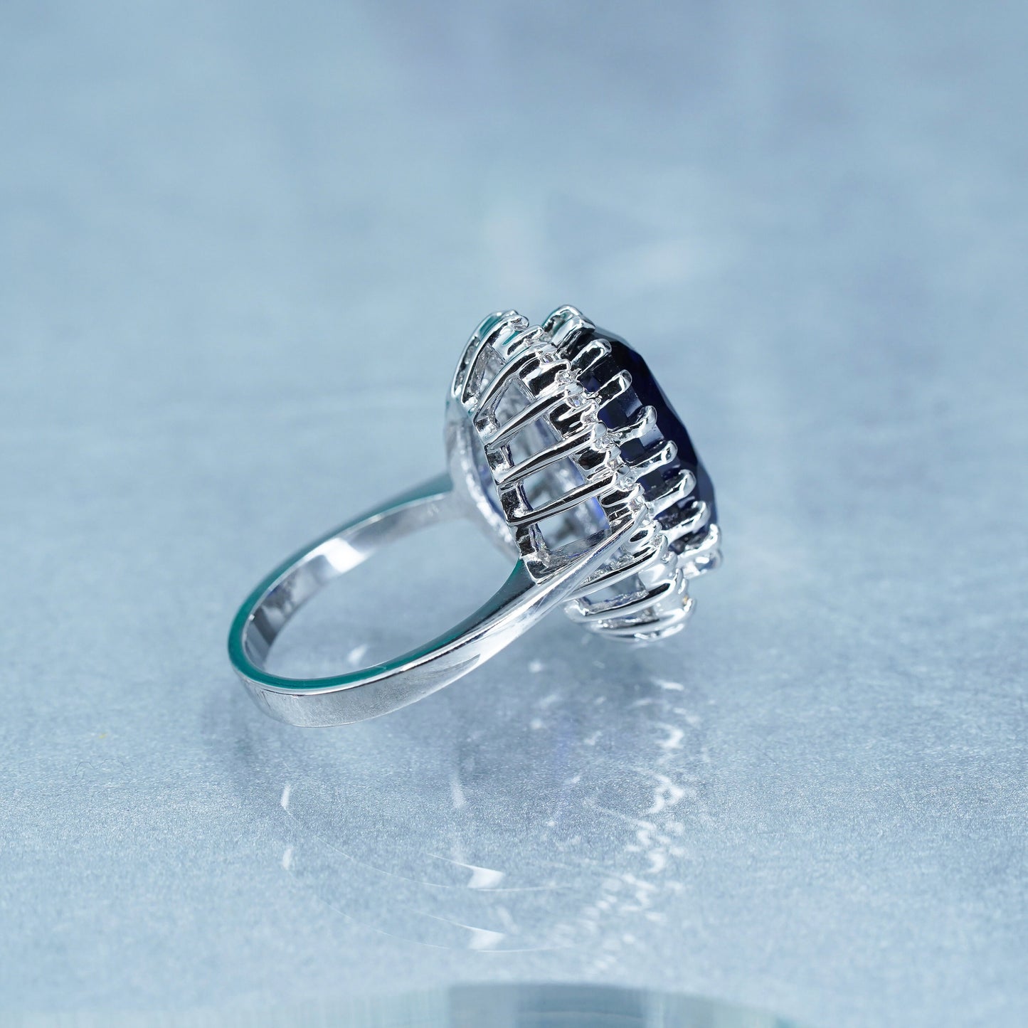 Size 8.25, vintage silver tone statement ring with blue glass and cz around