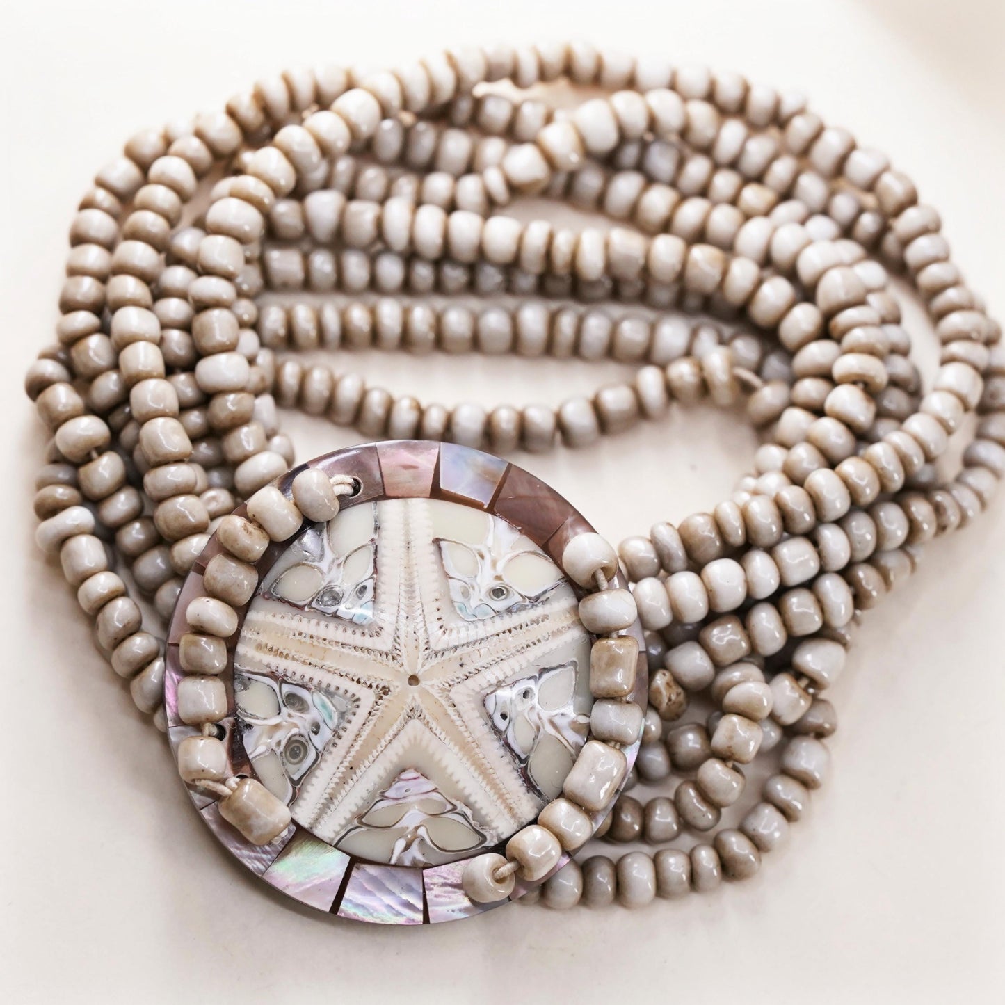 8", Vintage stretchy band, multi strands bead bracelet fossilized sand dollar