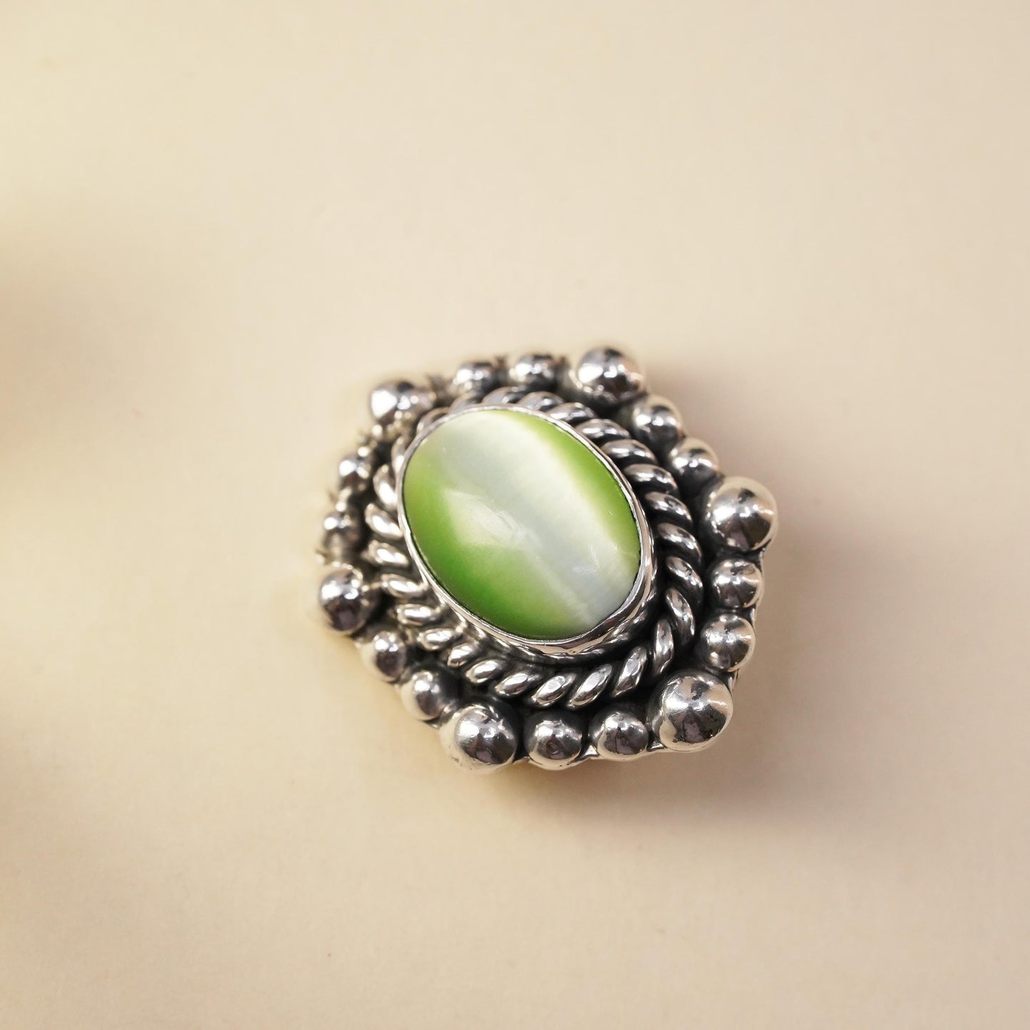 Mexican sterling silver single earring, 925 silver clip on with green cat’s eye