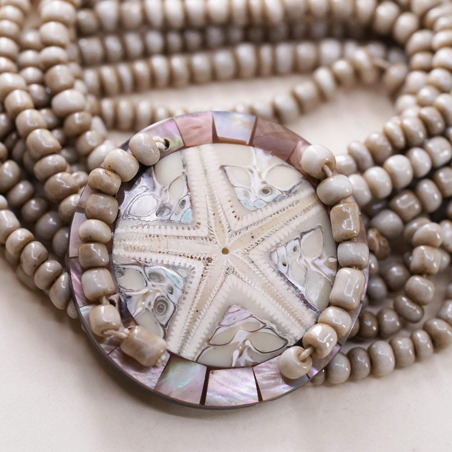 8", Vintage stretchy band, multi strands bead bracelet fossilized sand dollar