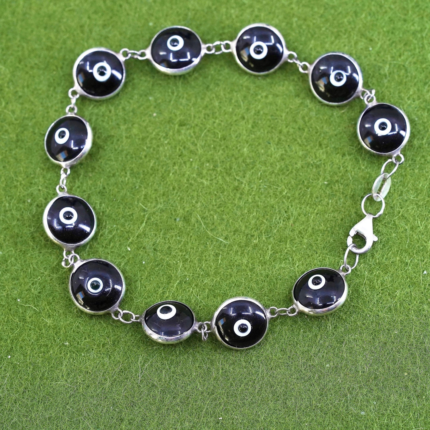 6.75”, vintage handmade sterling silver bracelet, black glass evil eye beads