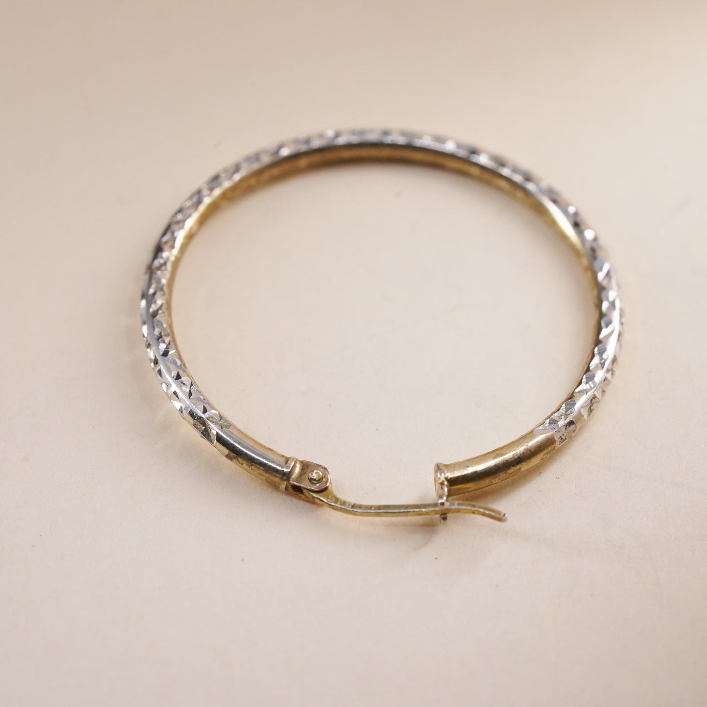 1.25", vermeil yellow gold over sterling silver single earring, textured hoop