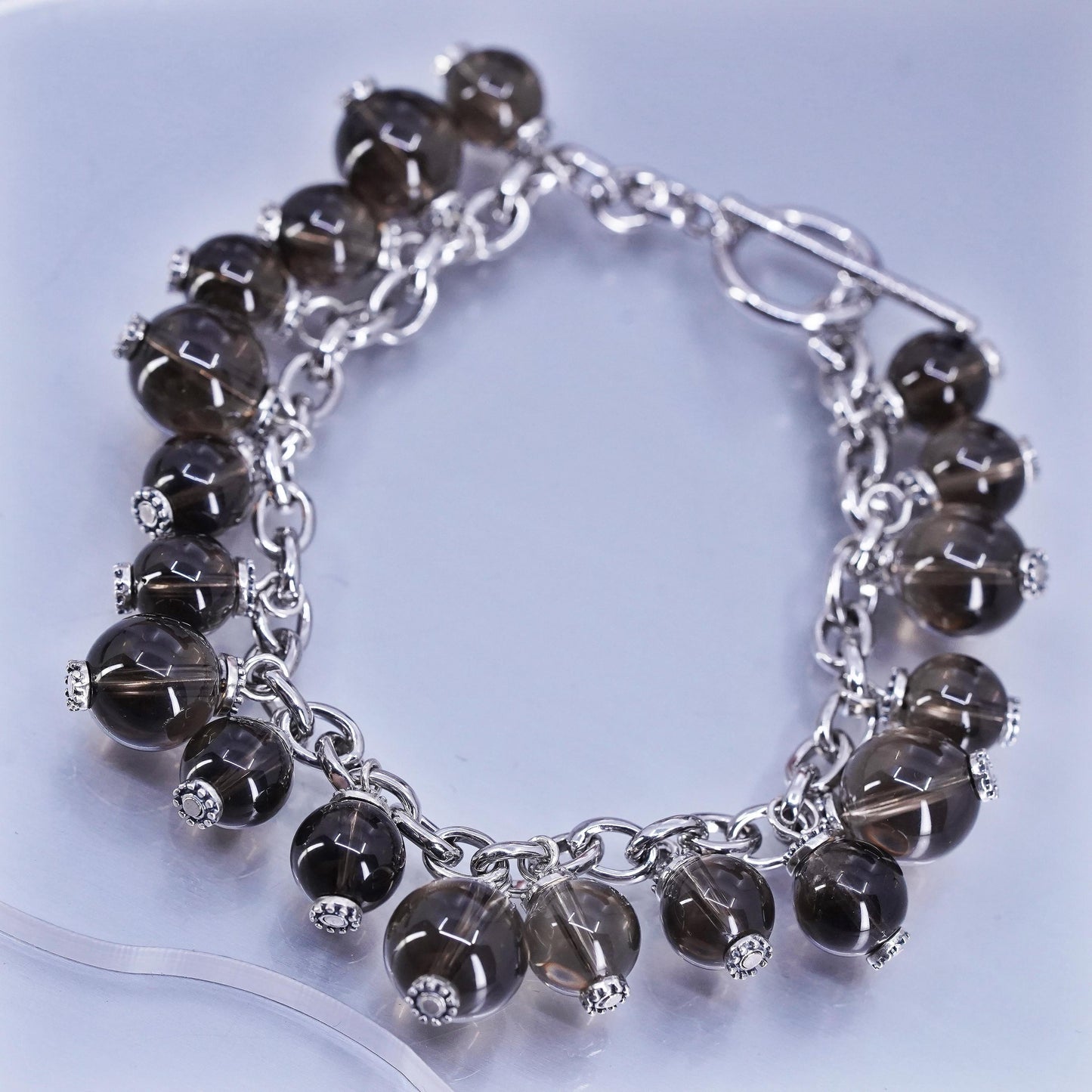 6.75”, Sterling 925 silver bracelet with smoky crystal beads and toggle closure
