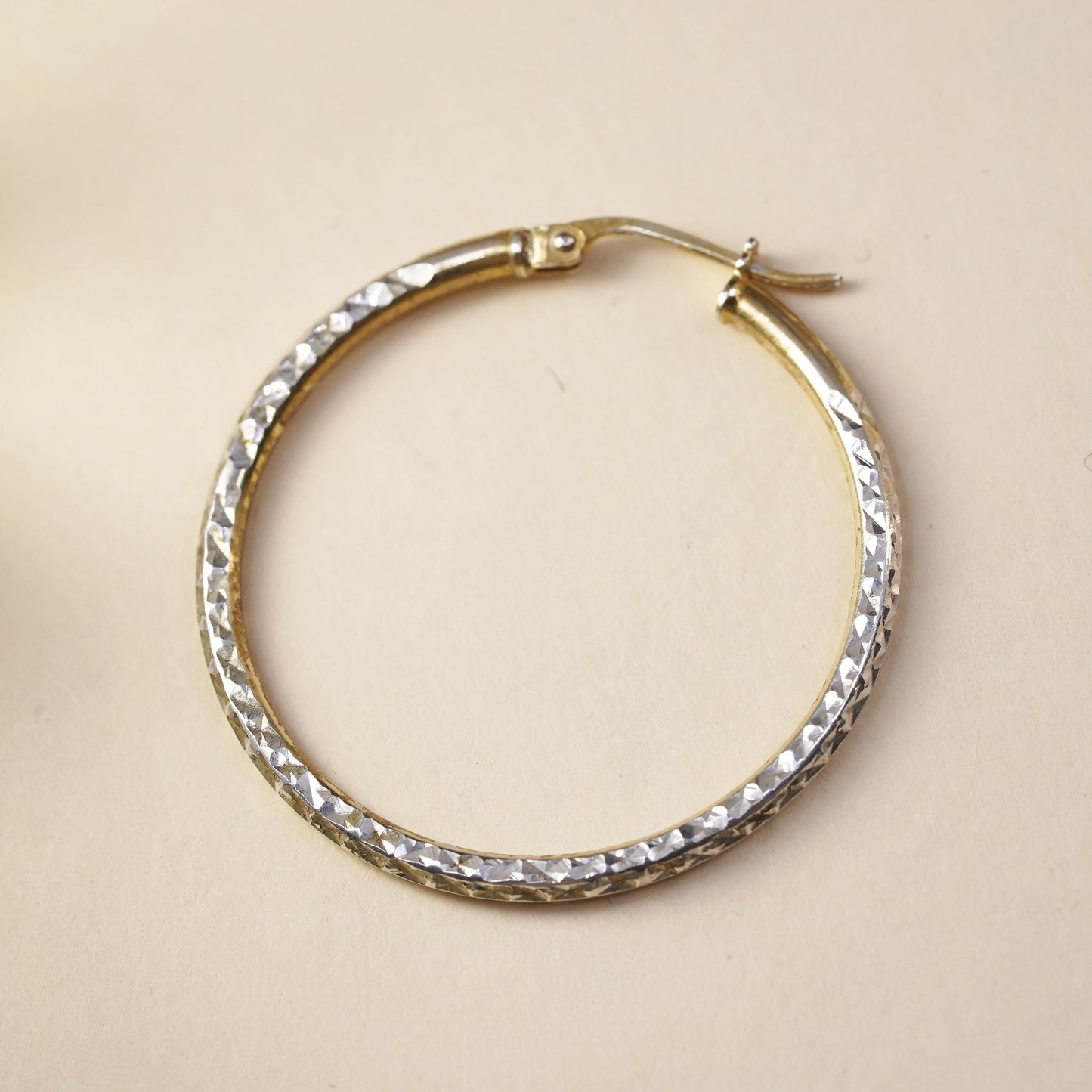1.25", vermeil yellow gold over sterling silver single earring, textured hoop