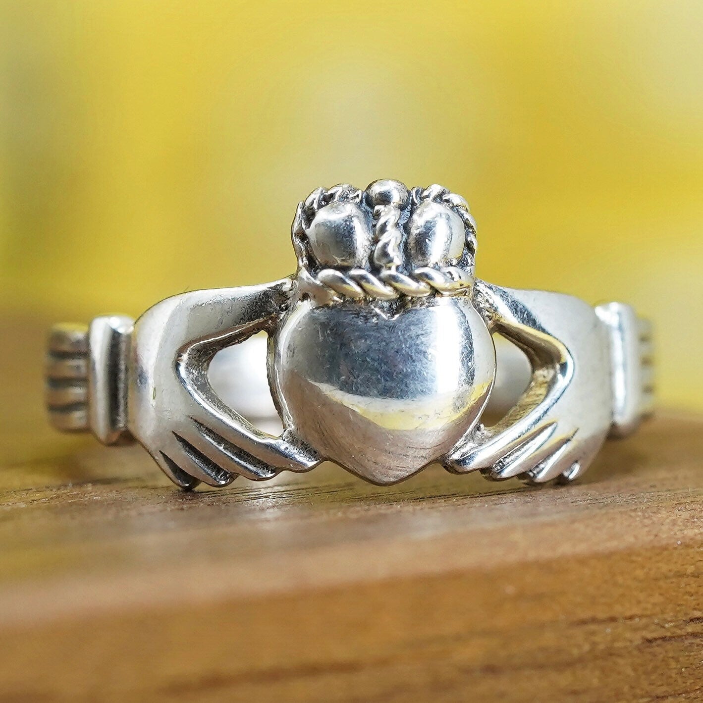 Size 8, irish sterling silver claddagh friendship ring, holding heart 925 band