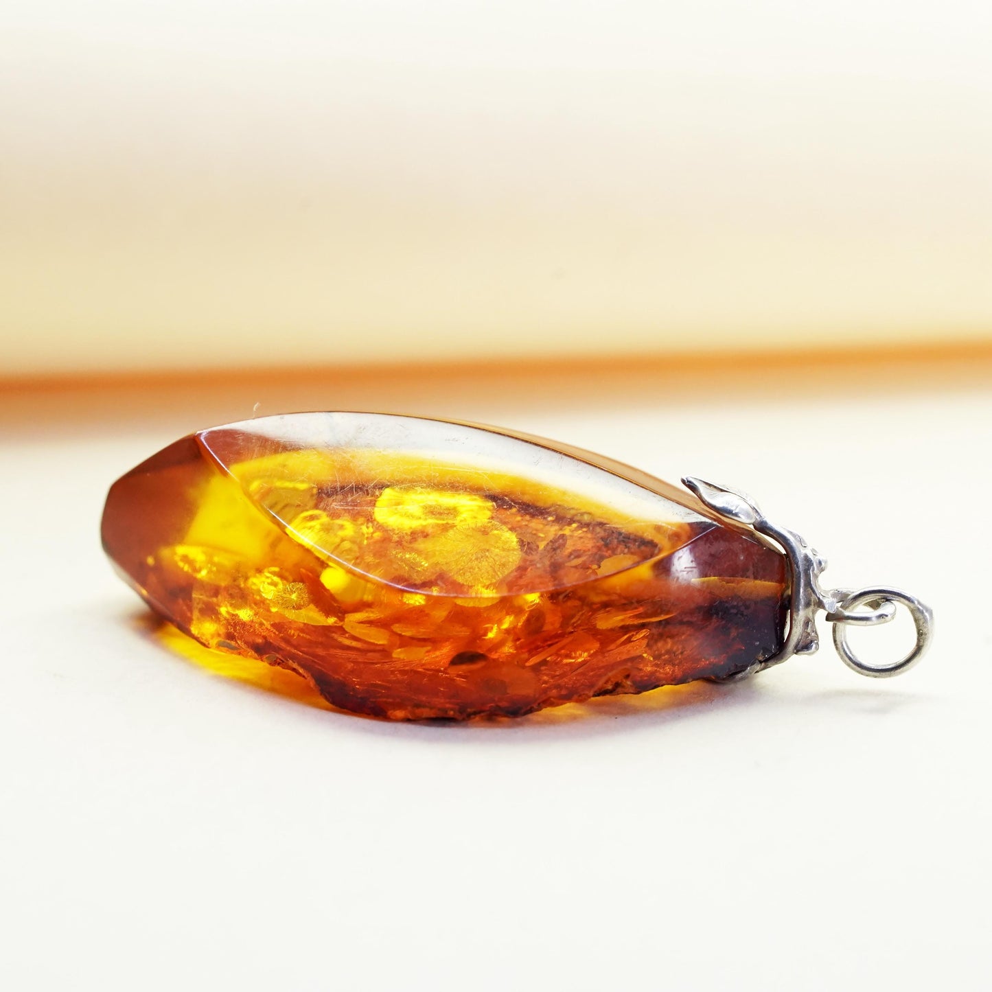 Vintage sterling 925 silver handmade pendant with amber nugget and leaf bail