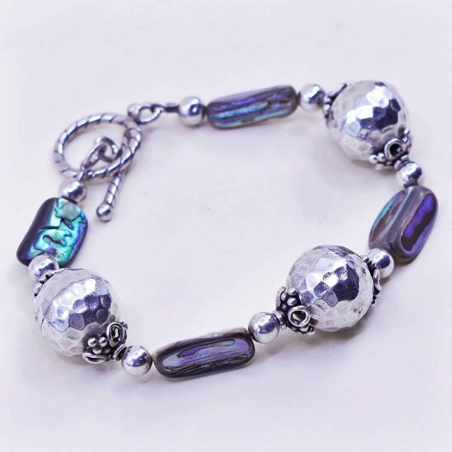 6.25”, vintage Sterling 925 silver bracelet, with hammered abalone beads