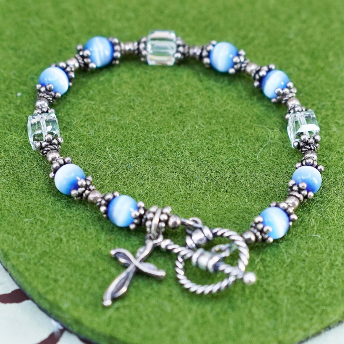 6”, Mexico 925 sterling silver bracelet with blue cats eye bead and cross charm