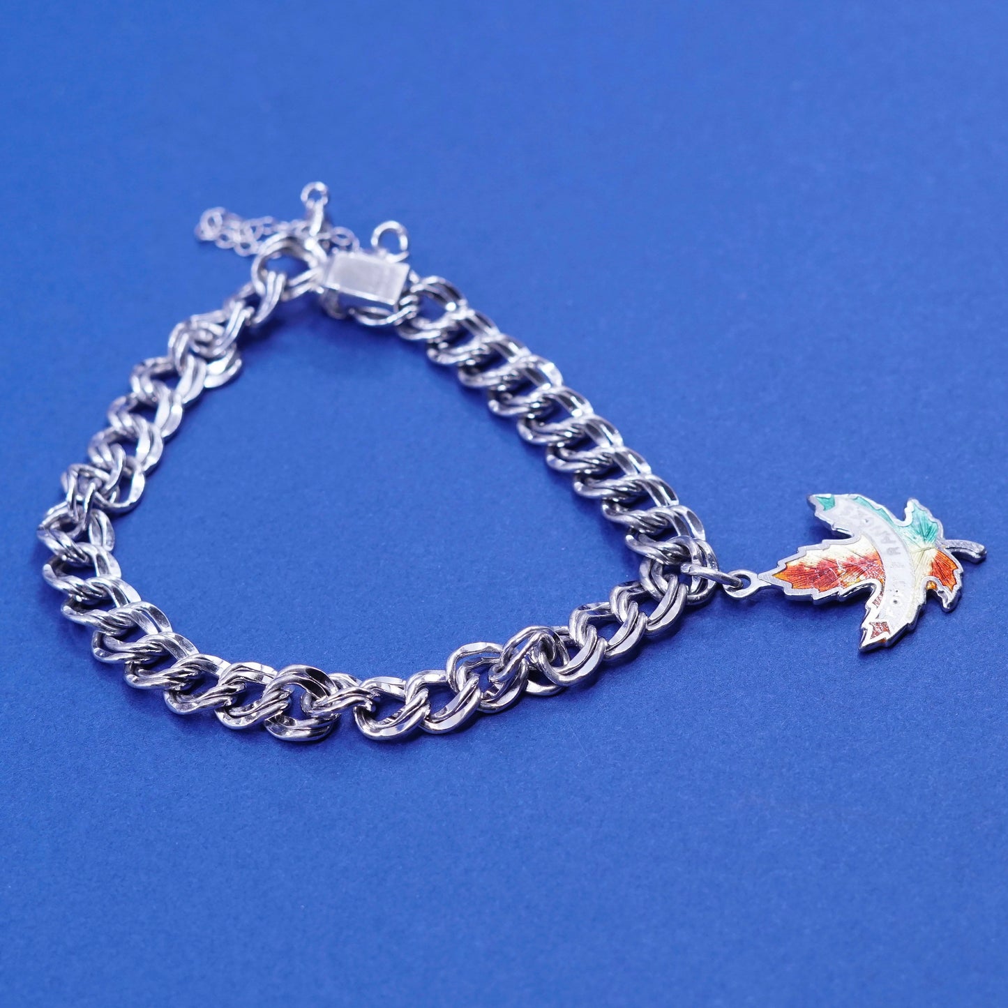 6.25”, Sterling silver bracelet, 925 double curb chain w/ Canada maple charm