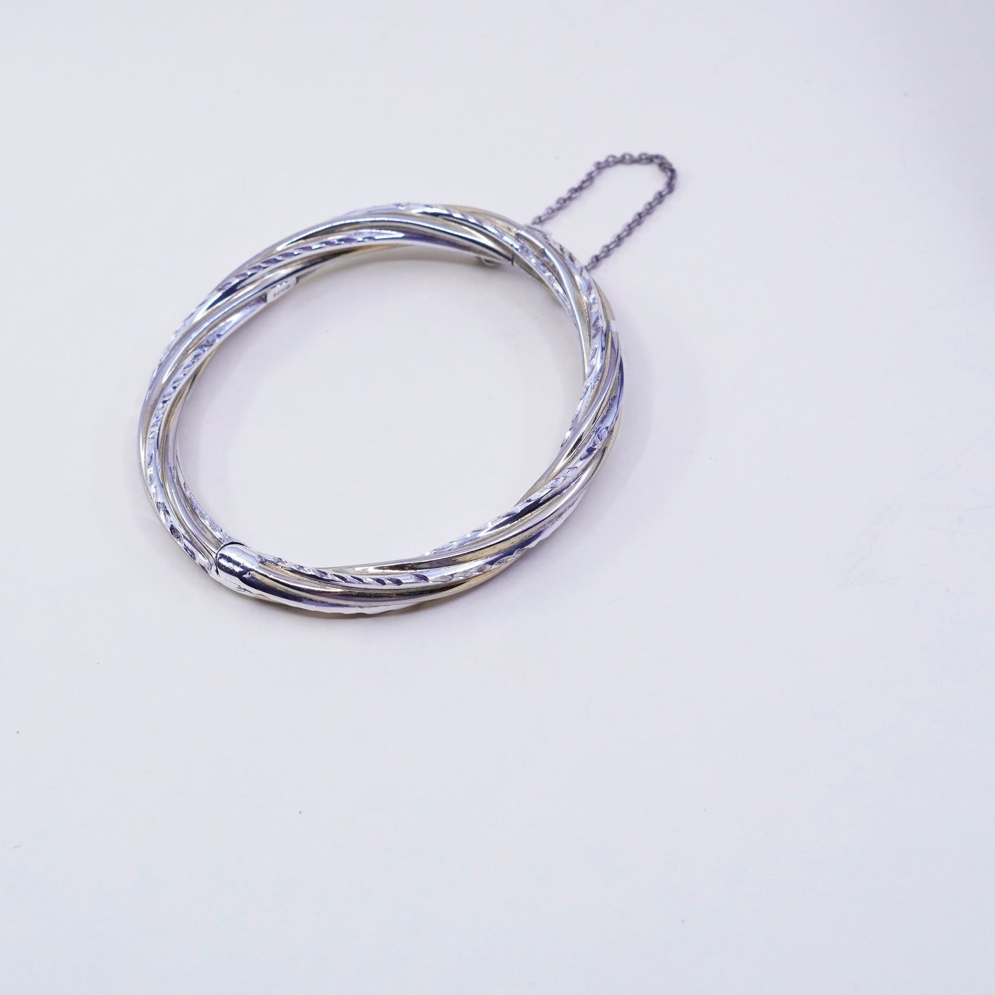7.25”, two tone sterling silver bracelet, 925 hinged diamond twisted bangle
