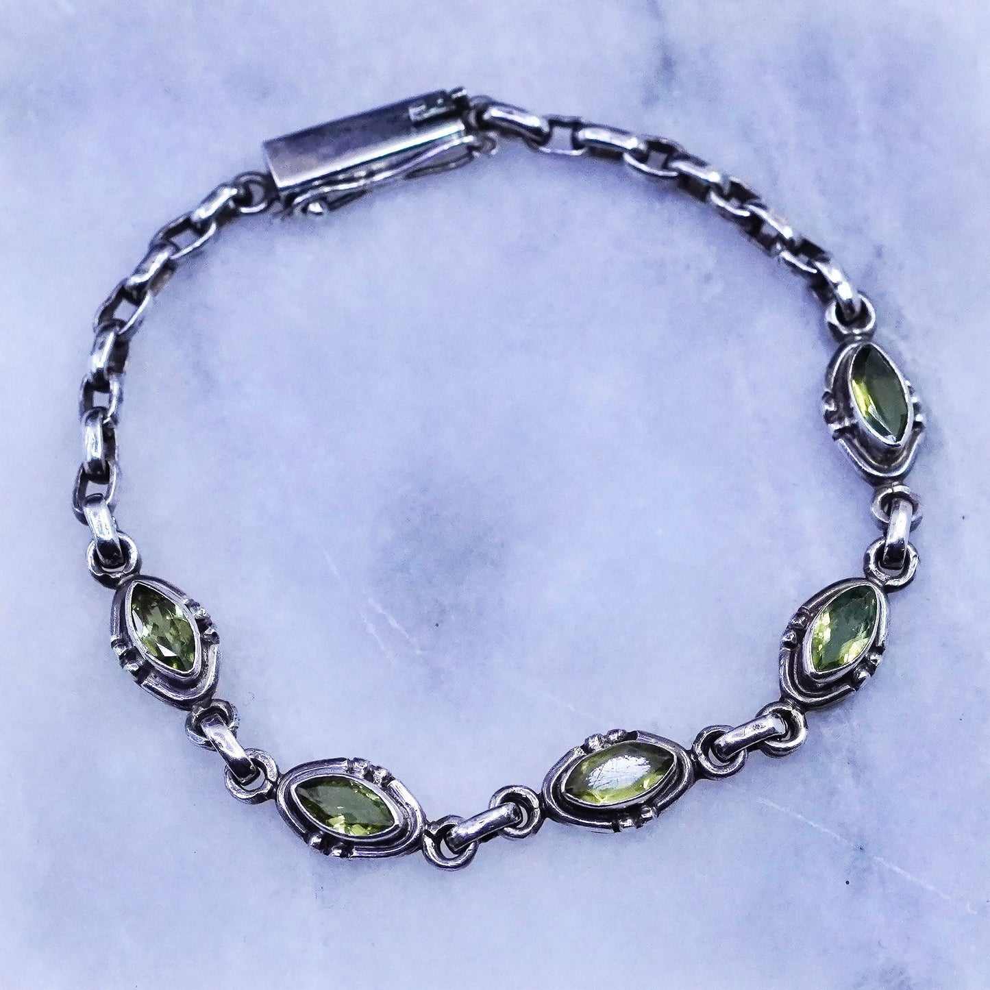 7”, vintage Sterling 925 silver tennis bracelet with marquise shaped peridot