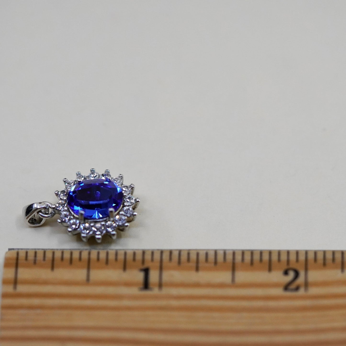 Vintage Sterling 925 silver pendant with oval blue topaz and cz around