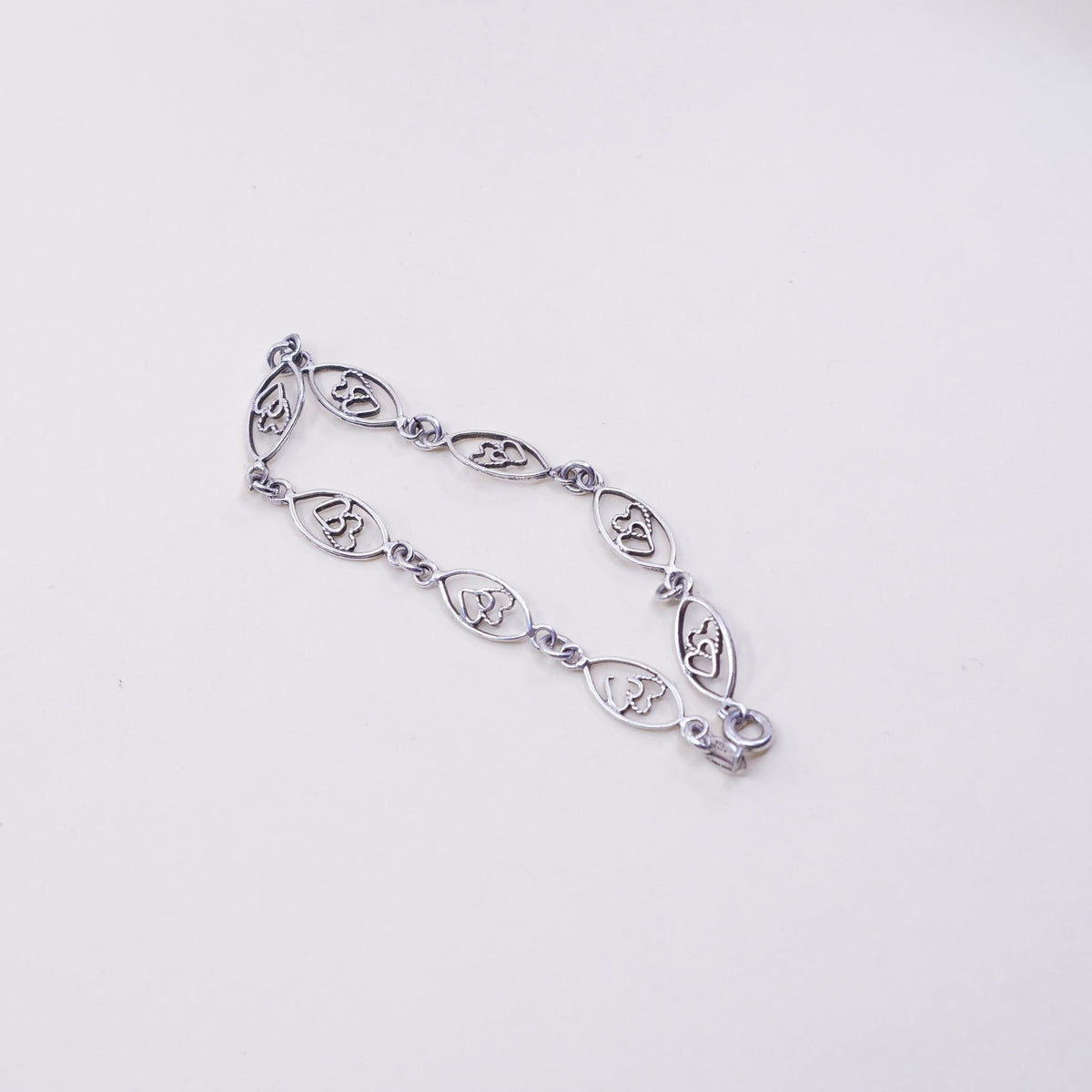 6.75”, sterling 925 silver Marquise shaped bracelet with double heart inside